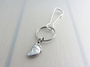 stainless steel single foot charm with indented heart on a bag charm with snap clip hook